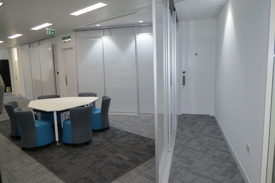 sliding whiteboards covering riser doors