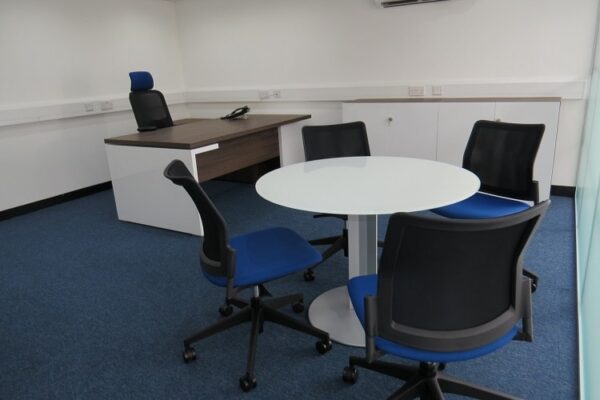 managers desk with round meeting table