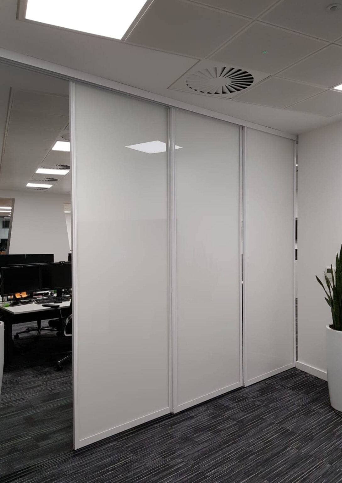 Sliding Whiteboard doors on tracks for F1 Team Fusion Office Design
