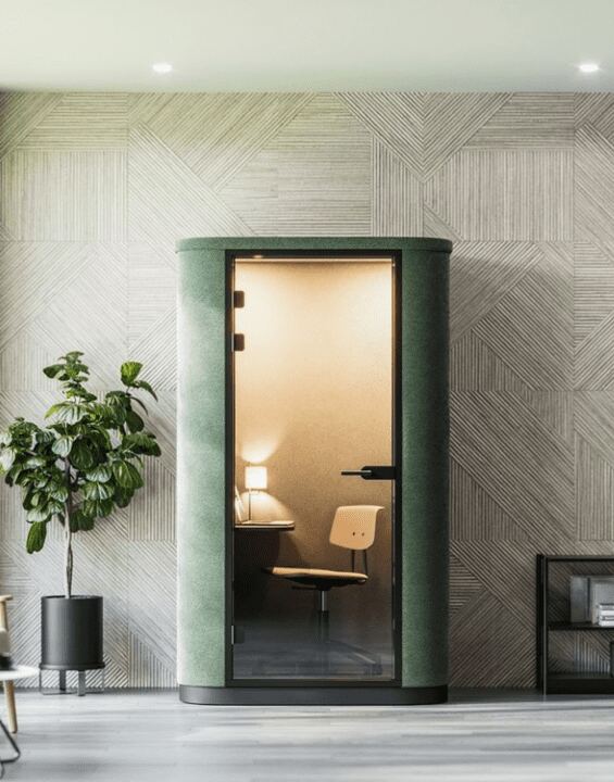 The Productivity Benefits of Having Office Pods | Fusion Office Design Individual office pod in phone booth style, upholstered in green fabric with internal furniture and lighting