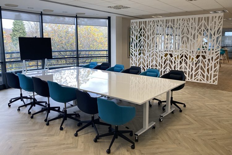 New office furniture with acoustic screens and whiteboard tabletop for collaboration