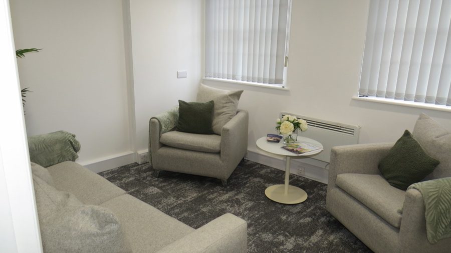 Breakout space in Victorian office with neutral colour palette and soft seating