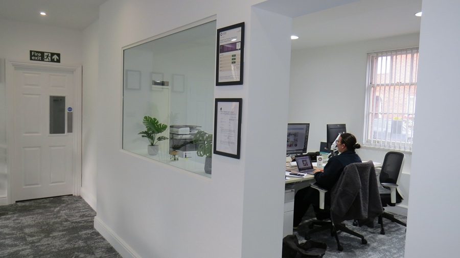 Structural wall with internal window and opening in Berkshire office