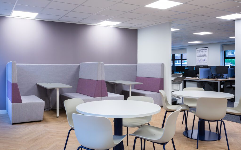 Dining booths and round dining tables in an office
