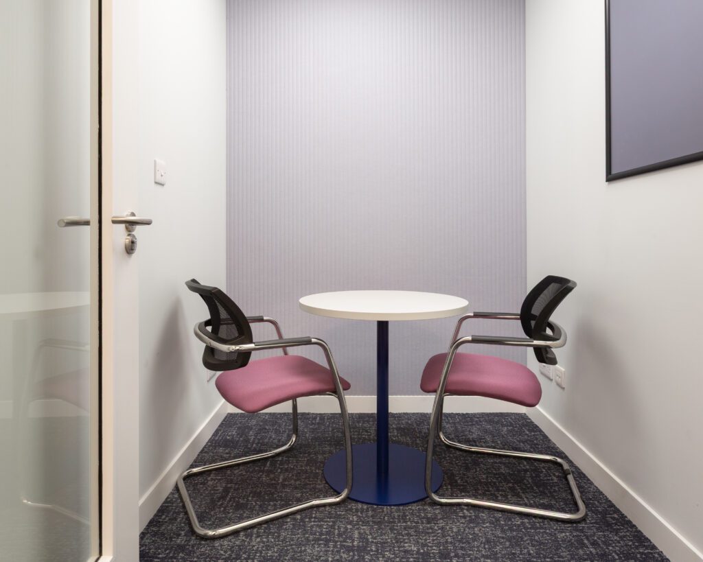 One-to-one meeting room with acoustic panelling on the wall
