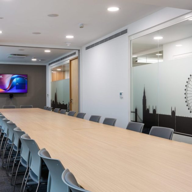 Folding partition wall in boardroom for multiple use space